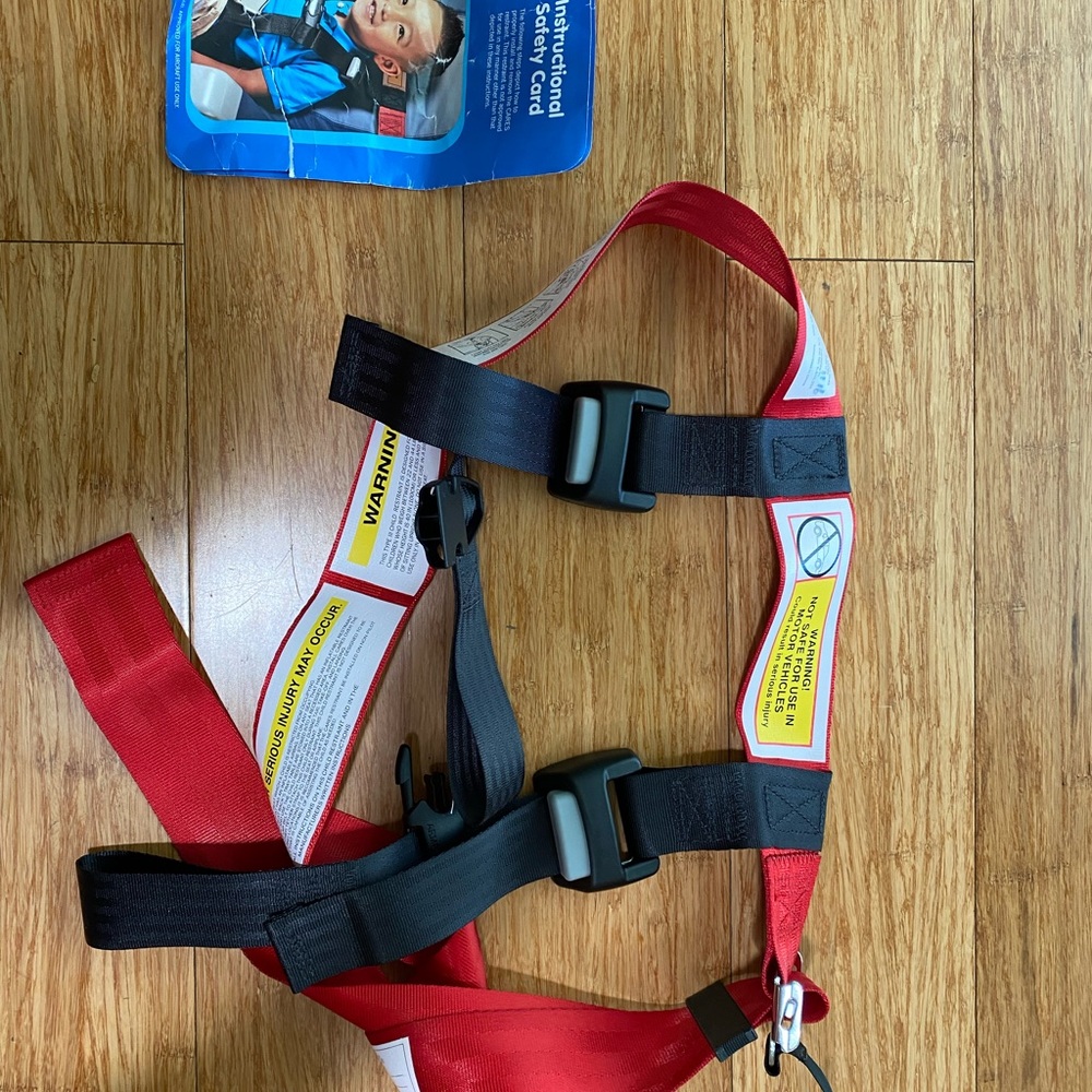 Kids fly safe airplane seat safety harness.